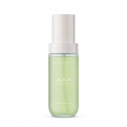 A bottle of The Lyfestyle Co. Align Hair & Body Mist, featuring a frosted plastic bottle filled with a light green liquid and a white spray dispenser, set against a plain white background.