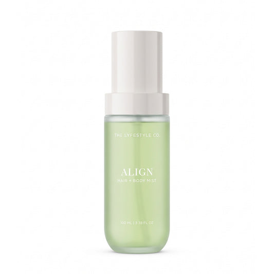 A bottle of The Lyfestyle Co. Align Hair & Body Mist, featuring a frosted plastic bottle filled with a light green liquid and a white spray dispenser, set against a plain white background.